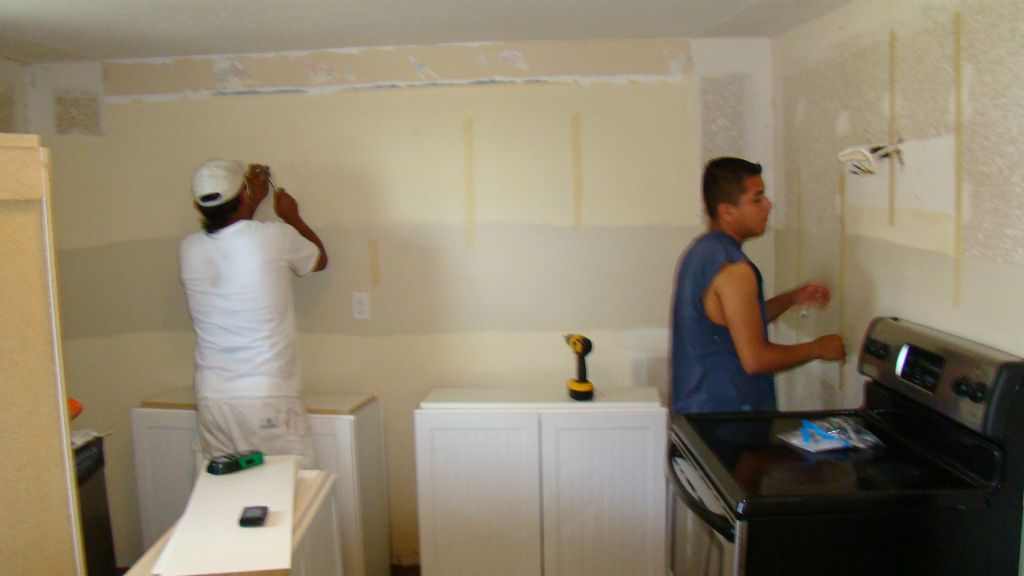 Prepping walls prior to hanging cabinets